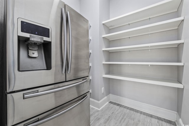 257 Venice Way Unit 2201, Myrtle Beach, SC 29577 - kitchen with freestanding refrigerator, light wood-style floors, and open shelves
