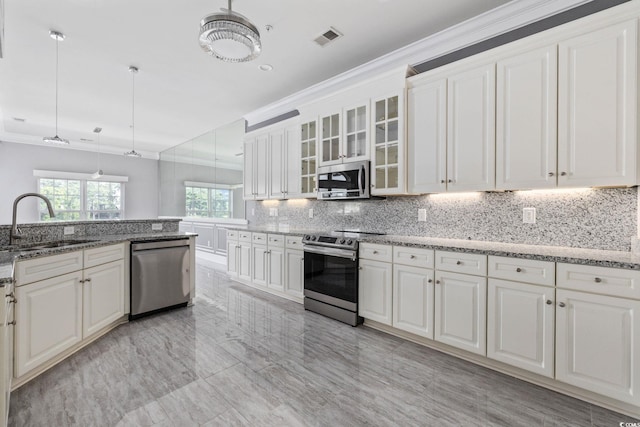 257 Venice Way Unit 2201, Myrtle Beach, SC 29577 - kitchen with appliances with stainless steel finishes, backsplash, white cabinets, and ornamental molding
