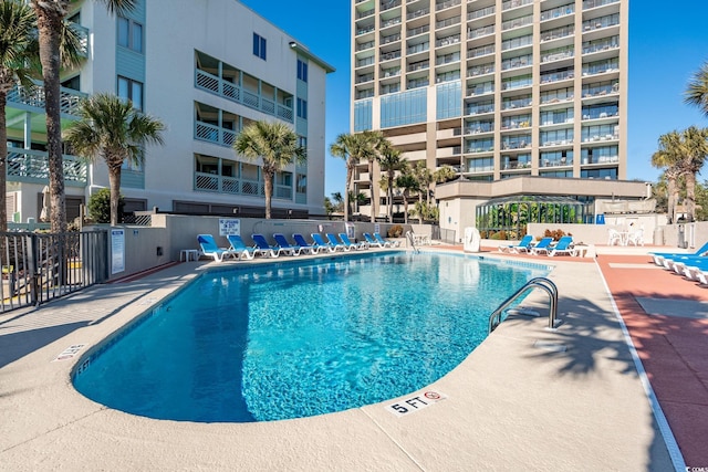 5523 N Ocean Blvd Unit 908, Myrtle Beach, SC 29577 - community pool featuring a patio