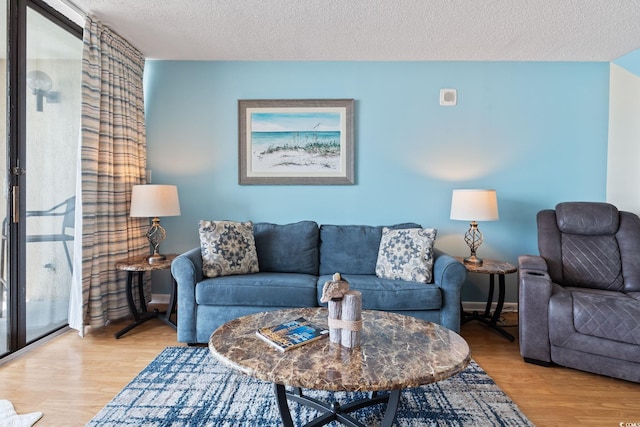 5523 N Ocean Blvd Unit 908, Myrtle Beach, SC 29577 - living room featuring wood finished floors and a textured ceiling