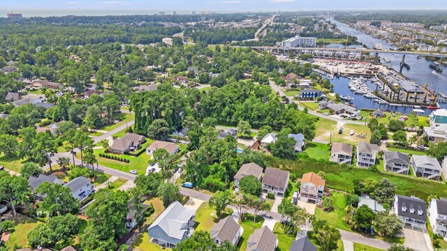 1712 26th Ave N, North Myrtle Beach, SC 29582 - aerial overview of property's location featuring a large body of water, numerous boat docks, and nearby suburban area