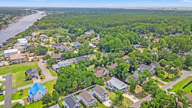 1712 26th Ave N, North Myrtle Beach, SC 29582 - aerial perspective of suburban area with a heavily wooded area