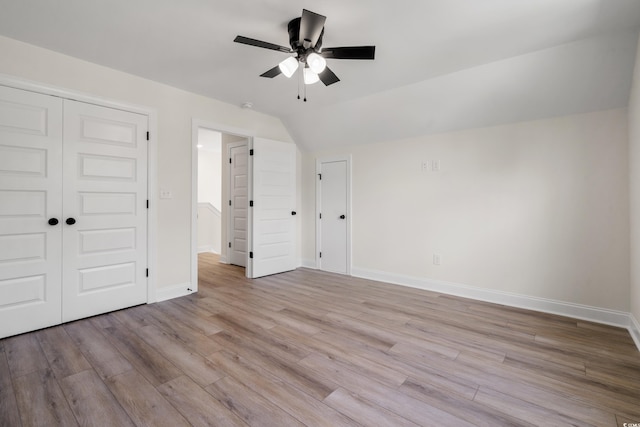 1712 26th Ave N, North Myrtle Beach, SC 29582 - unfurnished bedroom with wood finished floors, lofted ceiling, a ceiling fan, and a closet