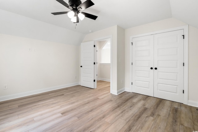 1712 26th Ave N, North Myrtle Beach, SC 29582 - unfurnished bedroom featuring light wood finished floors, vaulted ceiling, a closet, and a ceiling fan