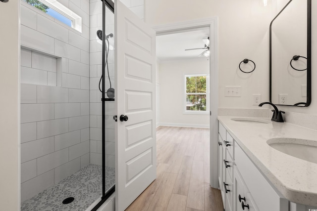 1712 26th Ave N, North Myrtle Beach, SC 29582 - full bathroom with tiled shower, ceiling fan, wood finished floors, and double vanity