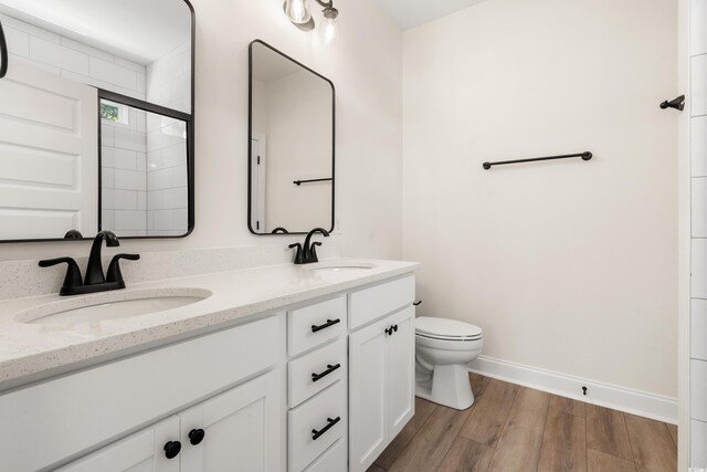 1712 26th Ave N, North Myrtle Beach, SC 29582 - full bath with double vanity, wood finished floors, and tiled shower