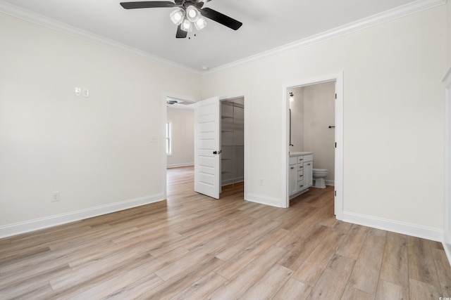 1712 26th Ave N, North Myrtle Beach, SC 29582 - unfurnished bedroom with crown molding, a closet, a spacious closet, light wood-style floors, and ensuite bathroom