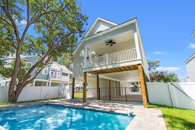 1712 26th Ave N, North Myrtle Beach, SC 29582 - rear view of property featuring a fenced backyard, ceiling fan, and a patio area