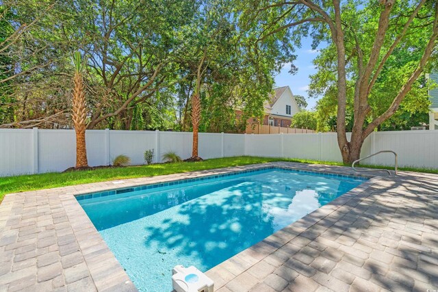 1712 26th Ave N, North Myrtle Beach, SC 29582 - view of pool featuring a fenced backyard and a patio area