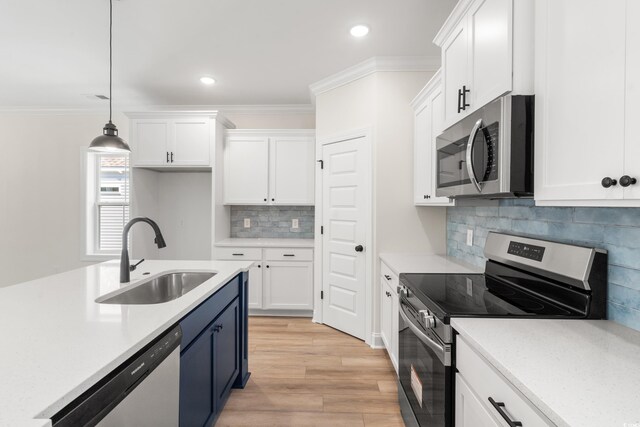 1712 26th Ave N, North Myrtle Beach, SC 29582 - kitchen with stainless steel appliances, white cabinets, light countertops, pendant lighting, and recessed lighting