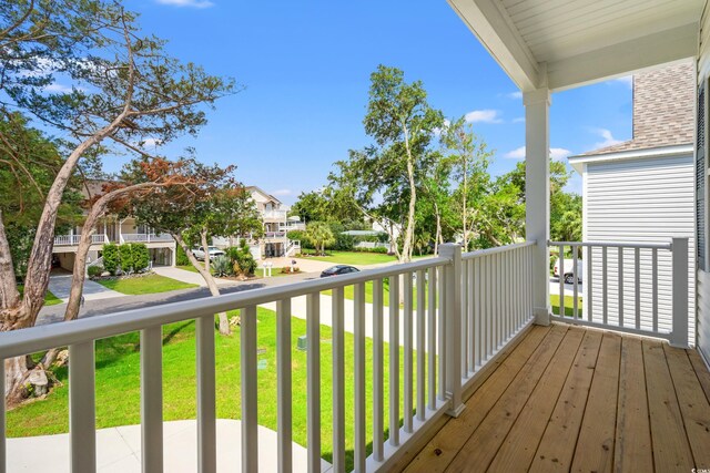 1712 26th Ave N, North Myrtle Beach, SC 29582 - deck featuring a residential view and a lawn