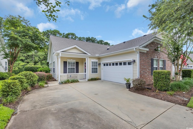 173 Knight Cir Unit 1, Pawleys Island, SC 29585 - ranch-style home featuring covered porch, an attached garage, concrete driveway, brick siding, and roof with shingles