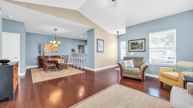 173 Knight Cir Unit 1, Pawleys Island, SC 29585 - living room with dark wood-style flooring, a chandelier, and vaulted ceiling