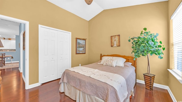 173 Knight Cir Unit 1, Pawleys Island, SC 29585 - bedroom with dark wood-style flooring, multiple windows, vaulted ceiling, and a closet