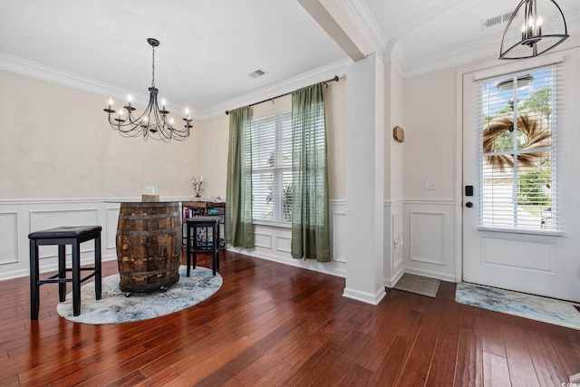 617 Carolina Farms Blvd, Myrtle Beach, SC 29579 - foyer featuring a chandelier, a decorative wall, wood-type flooring, healthy amount of natural light, and ornamental molding