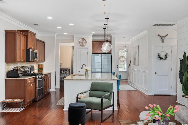 617 Carolina Farms Blvd, Myrtle Beach, SC 29579 - kitchen with appliances with stainless steel finishes, brown cabinets, dark wood-style floors, ornamental molding, and recessed lighting