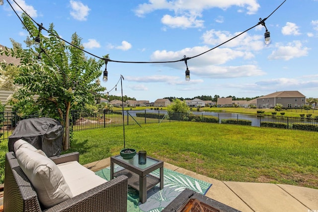 617 Carolina Farms Blvd, Myrtle Beach, SC 29579 - fenced backyard featuring a residential view, a patio, a water view, an outdoor living space, and grilling area