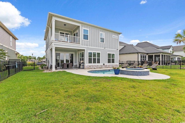 206 Palmetto Harbour Dr, North Myrtle Beach, SC 29582 - rear view of house featuring board and batten siding, a balcony, a fenced backyard, and a patio area