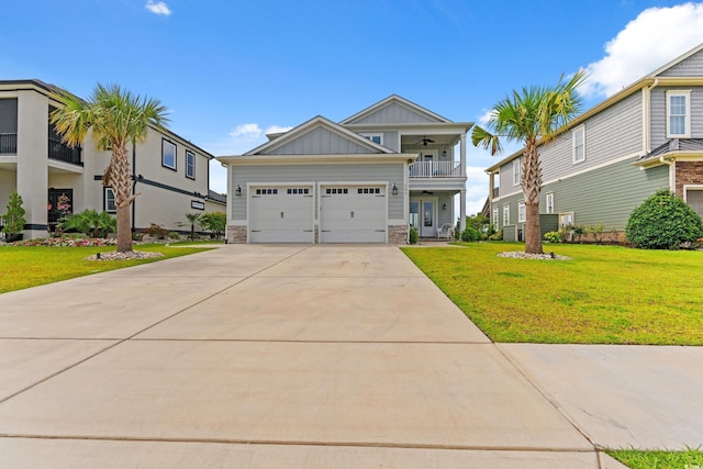 206 Palmetto Harbour Dr, North Myrtle Beach, SC 29582 - view of front of home with board and batten siding, a ceiling fan, a front lawn, driveway, and an attached garage