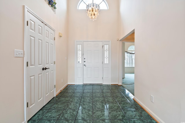 2443 Glen Dr, Little River, SC 29566 - entryway featuring a chandelier and a towering ceiling