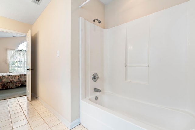2443 Glen Dr, Little River, SC 29566 - ensuite bathroom with washtub / shower combination and tile patterned flooring