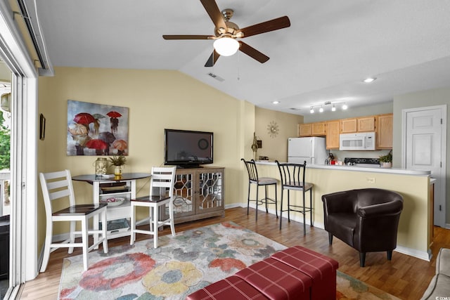 202 Landing Rd Unit 202H, North Myrtle Beach, SC 29582 - living room with a ceiling fan, wood finished floors, and vaulted ceiling