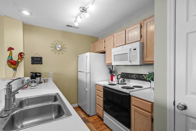 202 Landing Rd Unit 202H, North Myrtle Beach, SC 29582 - kitchen with white appliances, light wood-style floors, light countertops, light brown cabinets, and a textured ceiling