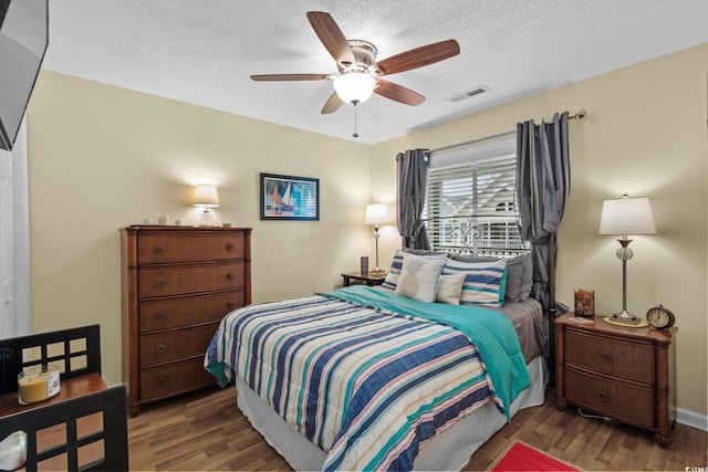 202 Landing Rd Unit 202H, North Myrtle Beach, SC 29582 - bedroom featuring wood finished floors, a textured ceiling, and a ceiling fan