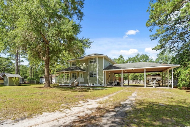 315 N River Pines Rd, Mullins, SC 29574 - view of front of property featuring dirt driveway, a storage unit, a front lawn, a carport, and crawl space
