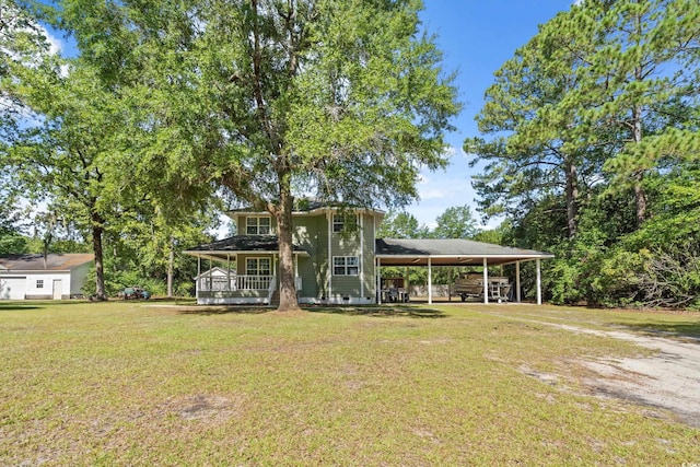 315 N River Pines Rd, Mullins, SC 29574 - view of front of home featuring a front yard, a porch, and a carport