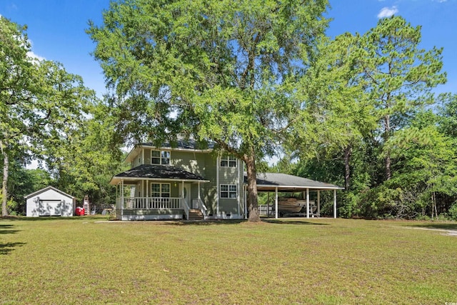 315 N River Pines Rd, Mullins, SC 29574 - view of front facade with a front yard, a garage, a porch, and a storage shed