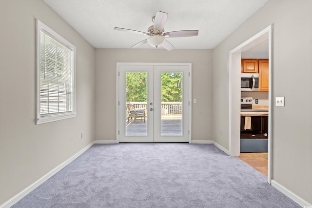315 N River Pines Rd, Mullins, SC 29574 - spare room featuring french doors, light colored carpet, a ceiling fan, and a textured ceiling