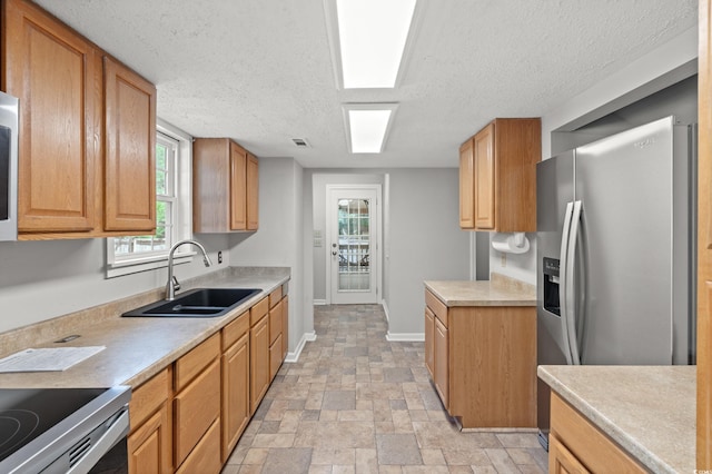 315 N River Pines Rd, Mullins, SC 29574 - kitchen with stainless steel fridge, light countertops, a textured ceiling, light stone finish floors, and white microwave