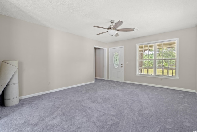 315 N River Pines Rd, Mullins, SC 29574 - unfurnished living room with ceiling fan, carpet floors, and a textured ceiling