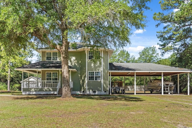 315 N River Pines Rd, Mullins, SC 29574 - farmhouse-style home featuring a front lawn, an attached carport, and a porch