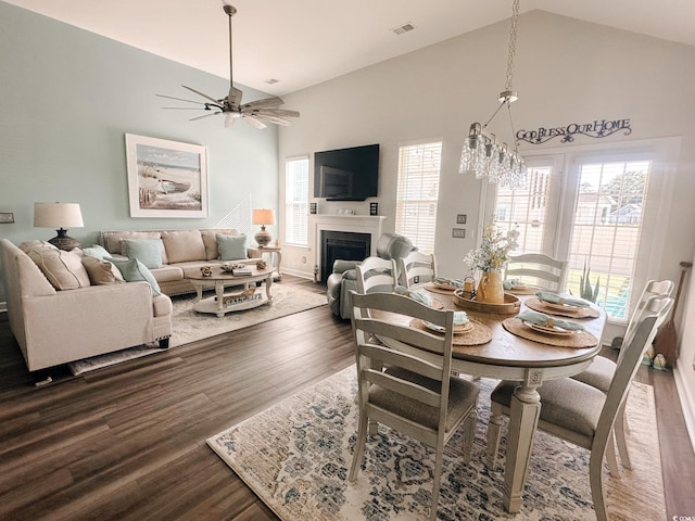 240 Sundew Loop, Little River, SC 29566 - dining room featuring high vaulted ceiling, wood finished floors, ceiling fan, and a fireplace