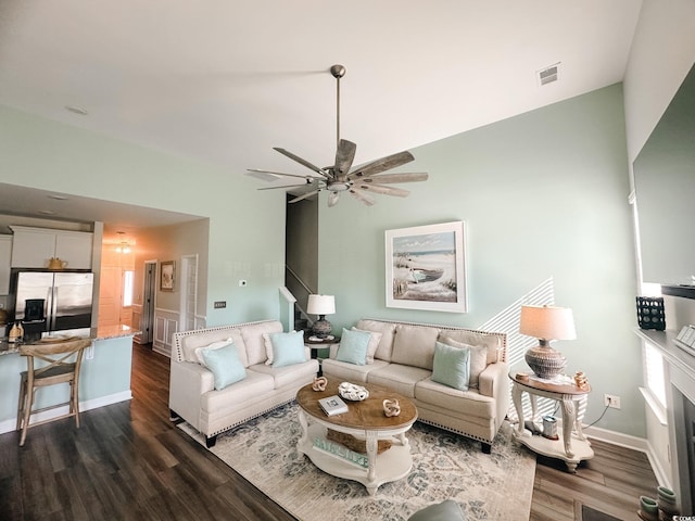 240 Sundew Loop, Little River, SC 29566 - living area with dark wood-style floors, a ceiling fan, vaulted ceiling, and stairway