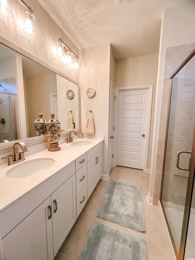 240 Sundew Loop, Little River, SC 29566 - bathroom featuring a shower stall, double vanity, and tile patterned flooring