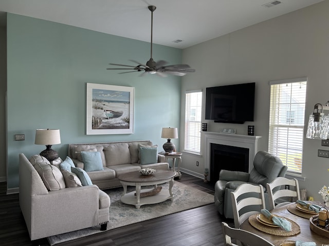 240 Sundew Loop, Little River, SC 29566 - living area with dark wood-style floors, a fireplace with flush hearth, and ceiling fan
