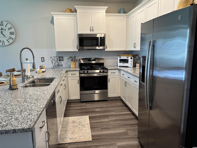 240 Sundew Loop, Little River, SC 29566 - kitchen with stainless steel appliances, a peninsula, and white cabinetry