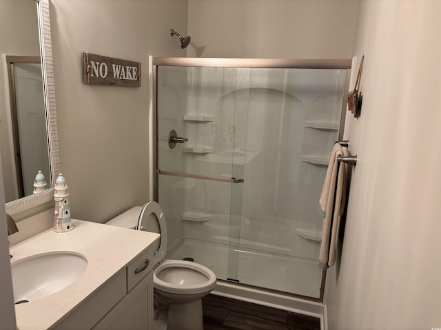 240 Sundew Loop, Little River, SC 29566 - full bath with a stall shower, vanity, and wood finished floors