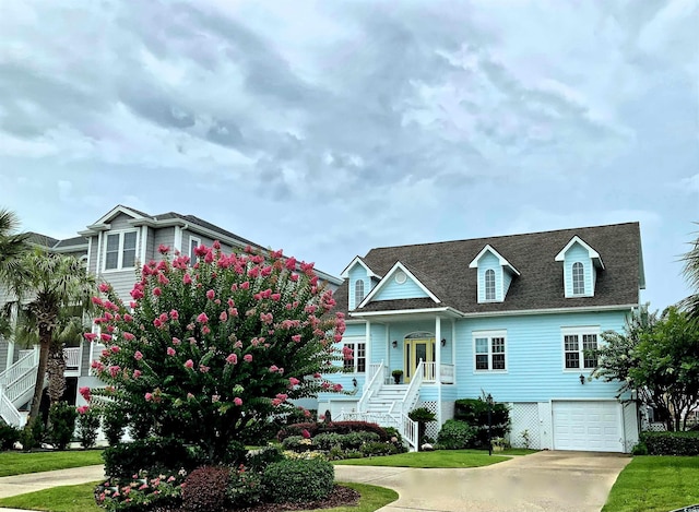 1605 Waterway Dr, North Myrtle Beach, SC 29582 - view of front of house featuring a garage, stairs, driveway, and a front yard