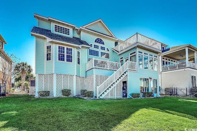 1605 Waterway Dr, North Myrtle Beach, SC 29582 - back of property featuring a balcony, a ceiling fan, and stairs
