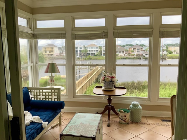 1605 Waterway Dr, North Myrtle Beach, SC 29582 - sunroom featuring a water view, tile patterned flooring, and a residential view