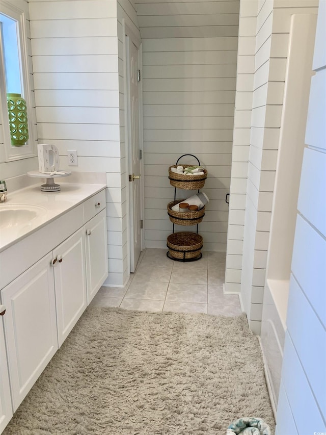 1605 Waterway Dr, North Myrtle Beach, SC 29582 - full bath featuring vanity, a tub to relax in, tile patterned flooring, and wooden walls