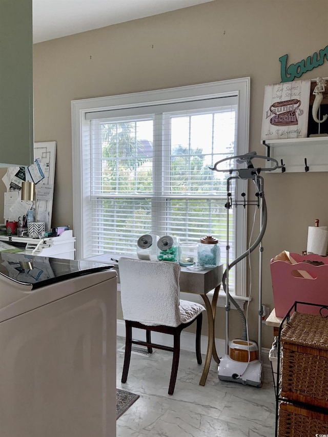 1605 Waterway Dr, North Myrtle Beach, SC 29582 - dining space with washer / dryer and light marble finish flooring