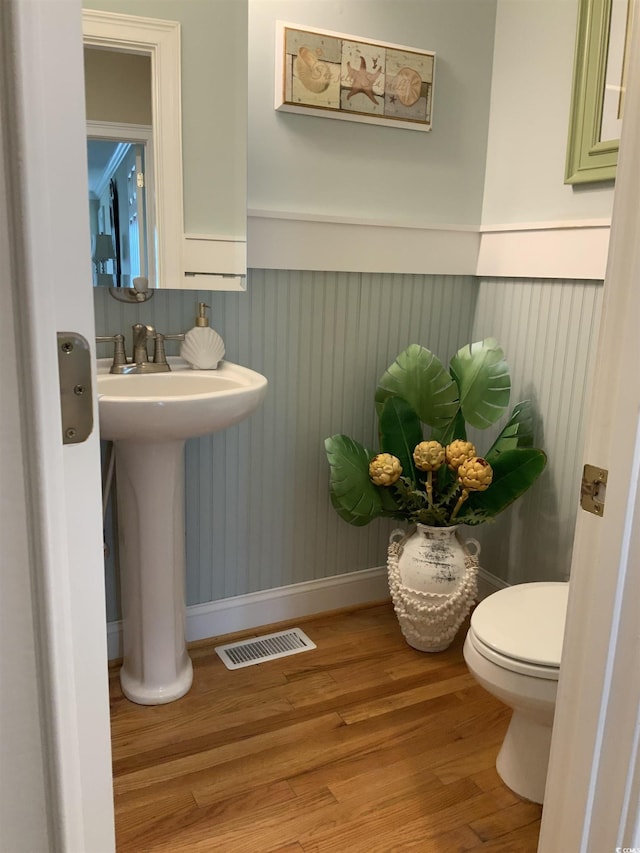 1605 Waterway Dr, North Myrtle Beach, SC 29582 - bathroom featuring wainscoting and wood finished floors