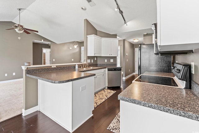 127 Ashworth Dr, Little River, SC 29566 - kitchen featuring stainless steel appliances, vaulted ceiling, a peninsula, dark countertops, and ceiling fan