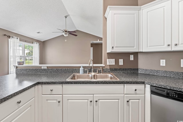 127 Ashworth Dr, Little River, SC 29566 - kitchen featuring dishwasher, ceiling fan, dark countertops, vaulted ceiling, and white cabinets