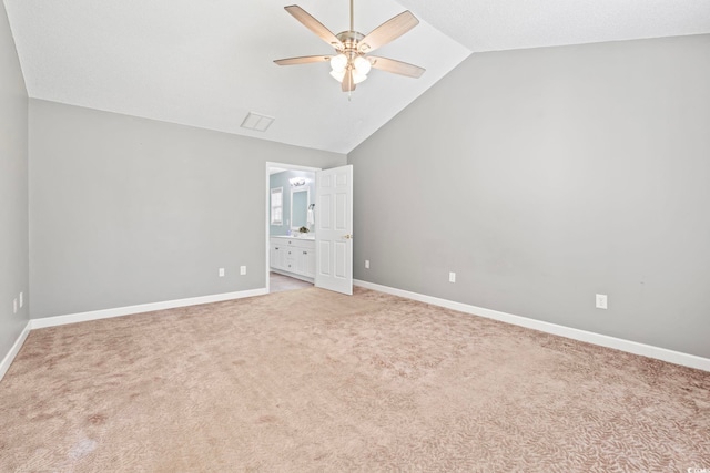 127 Ashworth Dr, Little River, SC 29566 - unfurnished bedroom with vaulted ceiling, light carpet, ensuite bath, and ceiling fan